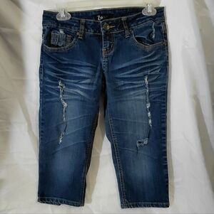 Mid-Rise Distressed Cropped Capris in Dark Blue